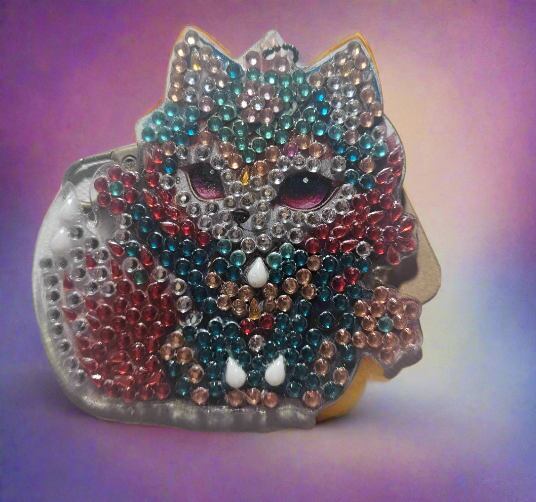Colorful beaded mask on a white background