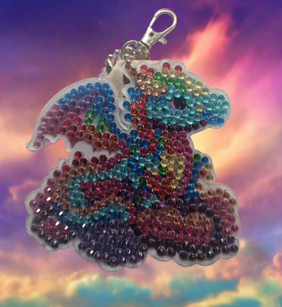 Colorful beaded bunny keychain on a white background