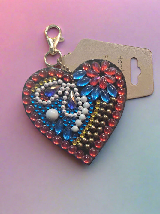 Colorful beaded keychain on a gray surface