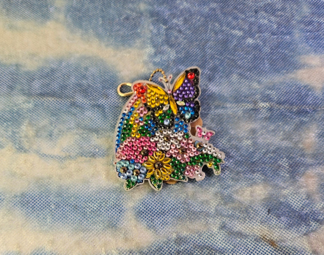 Butterfly-shaped decorative item on a textured fabric background