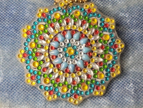 Decorative brooch on a textured fabric background
