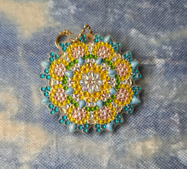 Decorative brooch on a textured fabric background